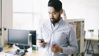 man holding phone and credit card.width .jpg