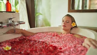 Woman relaxing in a soaking tub jbzLmS.width .jpg
