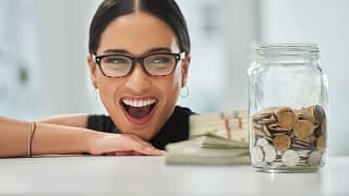 getty big smile jar of coins and cash millennial.jpg