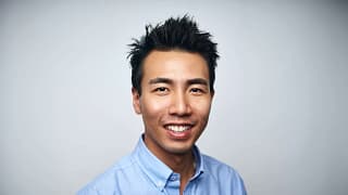 getty happy person in blue oxford shirt slight smiling.jpg