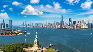 getty statue of liberty and new york city harbor aerial photo.jpg