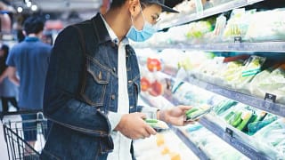 man in mask grocery shopping.width .jpg