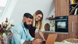 Couple looking up something together on lapto.width oTmPZpv.jpg