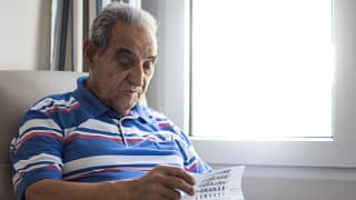 older person looking at a calendar.jpg