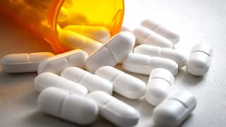 open pill bottle spilling out.jpg