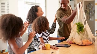 Father bringing home groceries to family GlSg.width .jpg