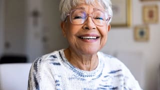 getty happy smiling in light colored top.jpg