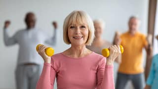getty smiling with weights exercise fitness workout.jpg