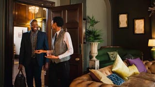 hotel employee showing guest into room miEihM.width .jpg