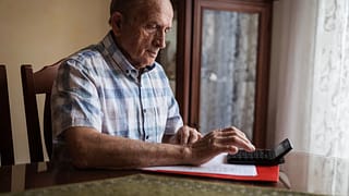 older man calculator gettyimages .jpg