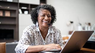 older woman laptop smiling gettyimages .jpg