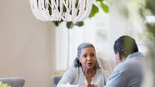 senior couple at table gettyimages .jpg