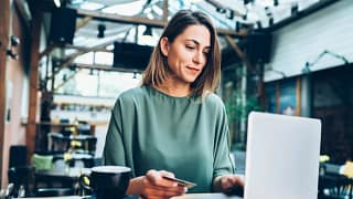 woman in cafe with laptop and credit card.width .jpg