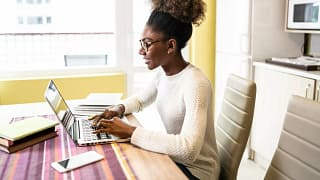 woman performs online job search from home SW.width .jpg