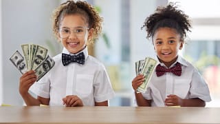 kids holding american currency.jpg