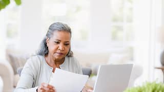 older woman document laptop.jpg