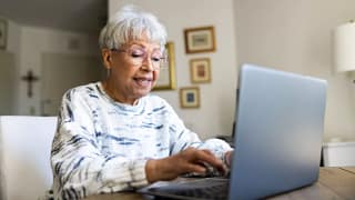 person using laptop in their home.jpg
