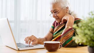 serious senior staring at laptop.jpg