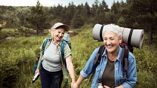 two older people outside hiking.jpg