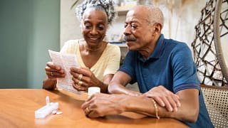 couple sitting at table looking at document.jpg