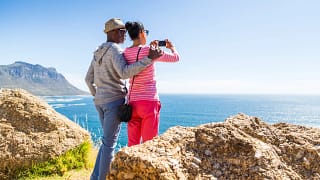 senior couple taking photo of the ocean.jpg