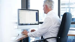 a person at a computer gettyimages .jpg