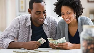 smiling couple counting money.jpg