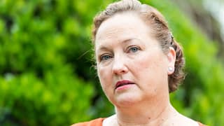 getty person looking concerned thoughtful worried green background.jpg