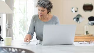 person sitting at table in front of computer.jpg