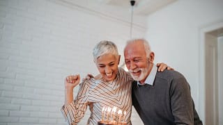 senior couple birthday cake gettyimages .jpg