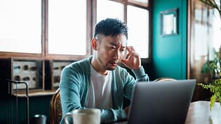 concerned unhappy person staring at laptop.jpg