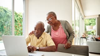 senior couple at laptop gettyimages .jpg