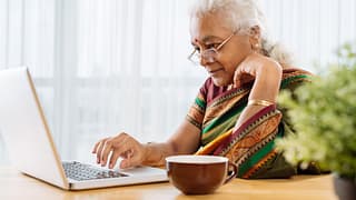serious senior staring at laptop.jpg