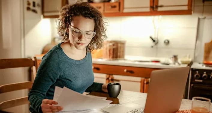 woman with bills and computer.width .jpg