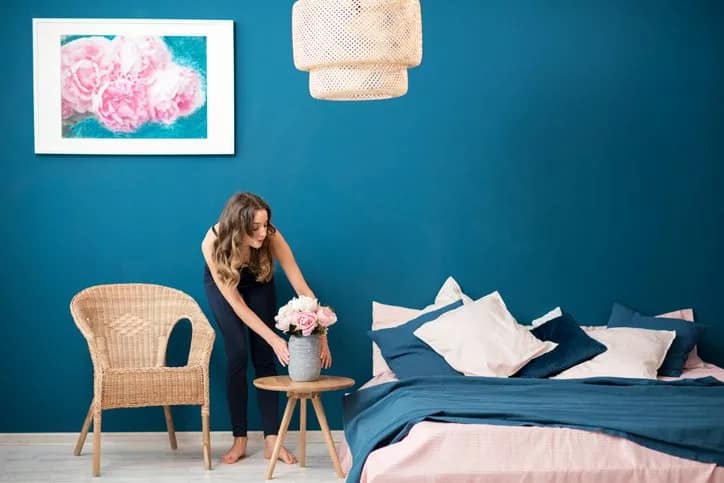 woman decorating bedroom.width .jpg