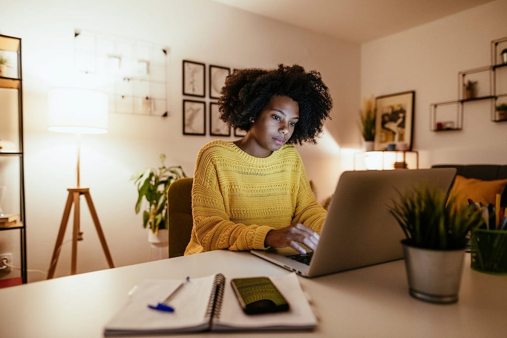 Woman using laptop at home for work or study .width .jpg