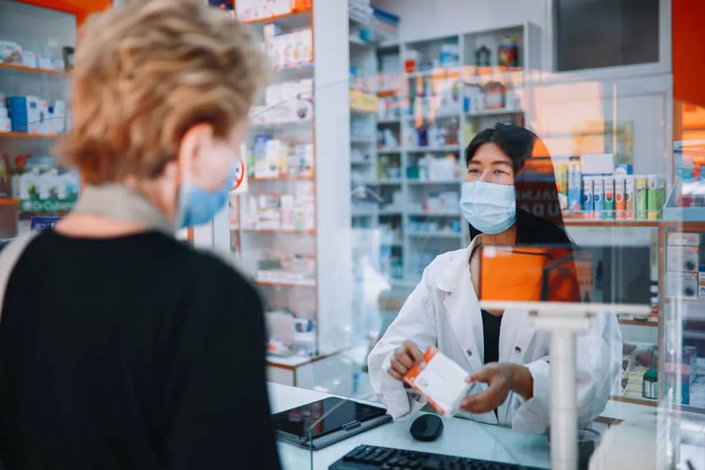 person receiving medicine from pharmacist IaP.width .jpg