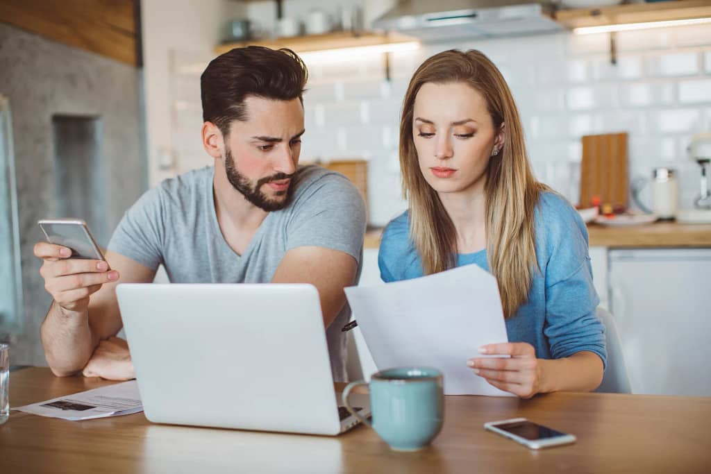 young couple looking over finances at home.jpg