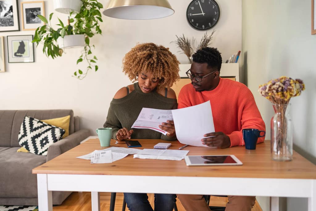 couple reviewing papers budgeting.jpg