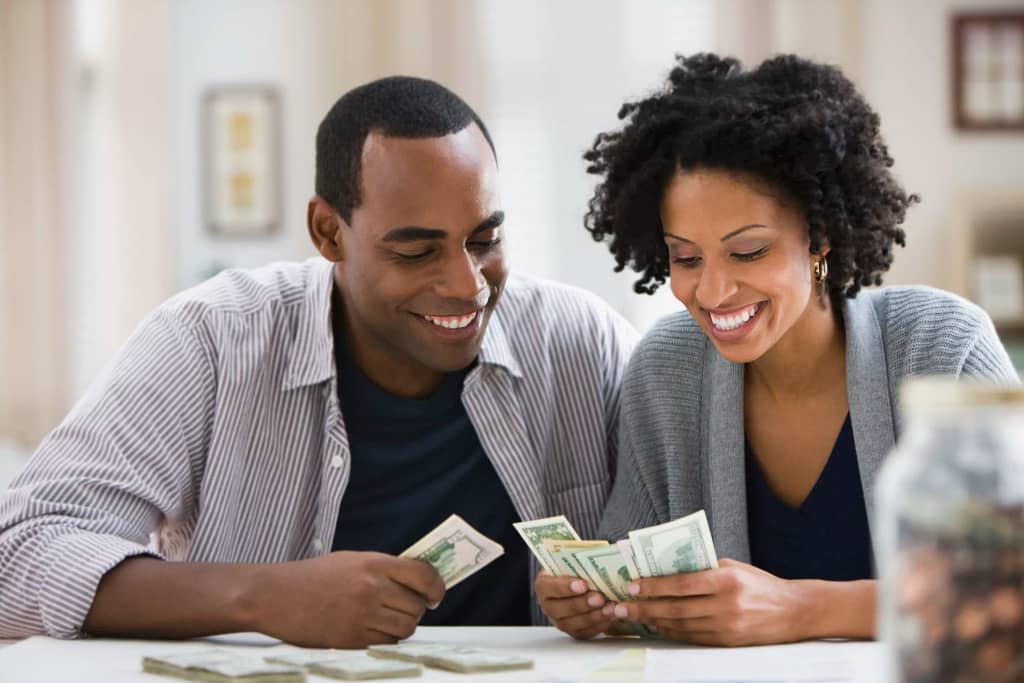 smiling couple counting money.jpg