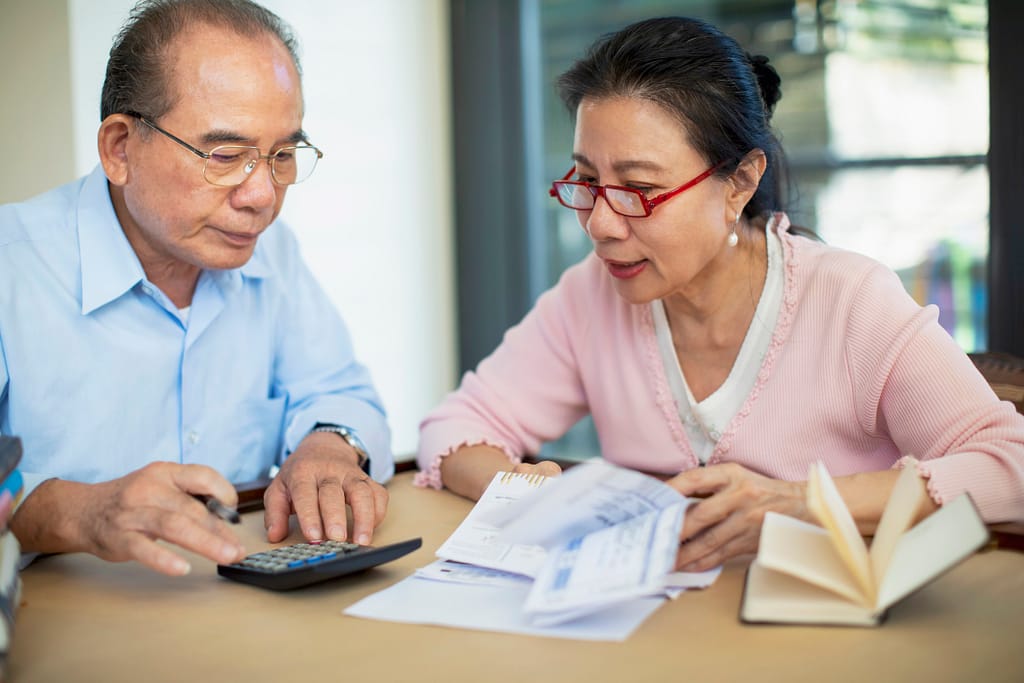 concerned senior asian couple.jpg