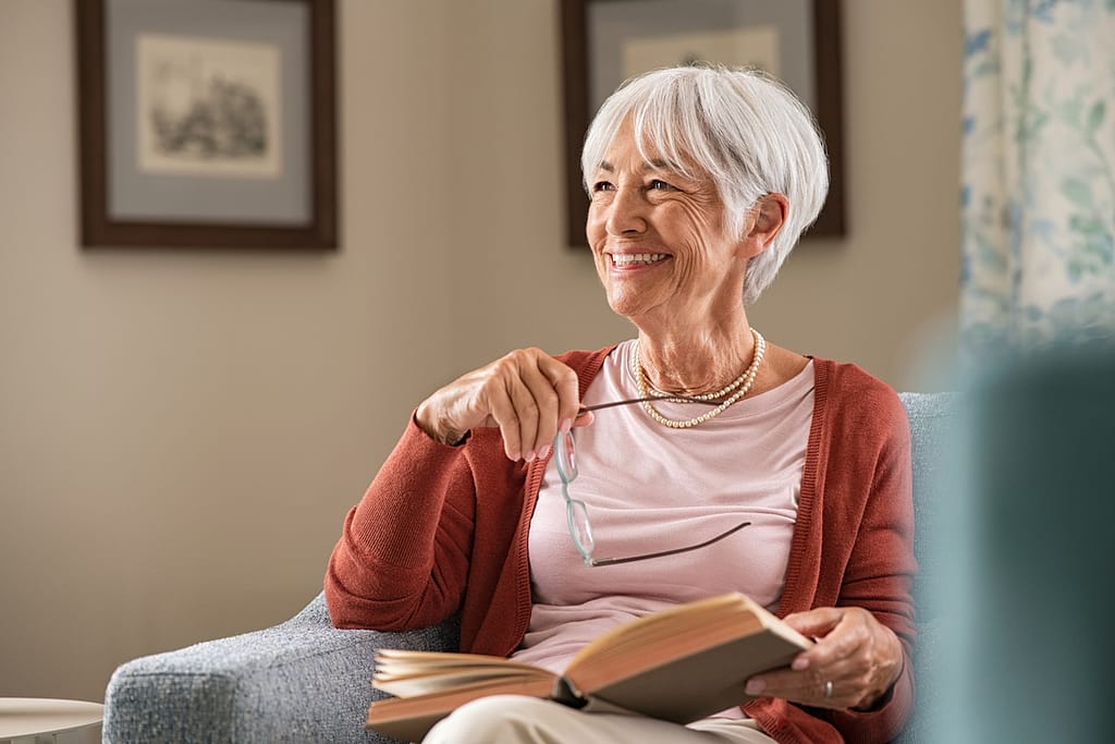 smiling person reading a book.jpg