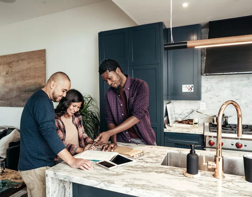 two people with contractor in kitchen OiPYQ.width .jpg