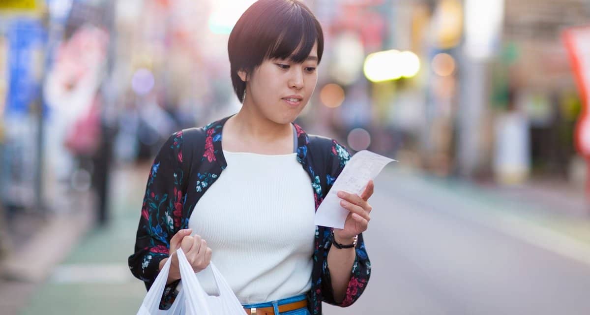 person with groceries and receipt NNaHY.width