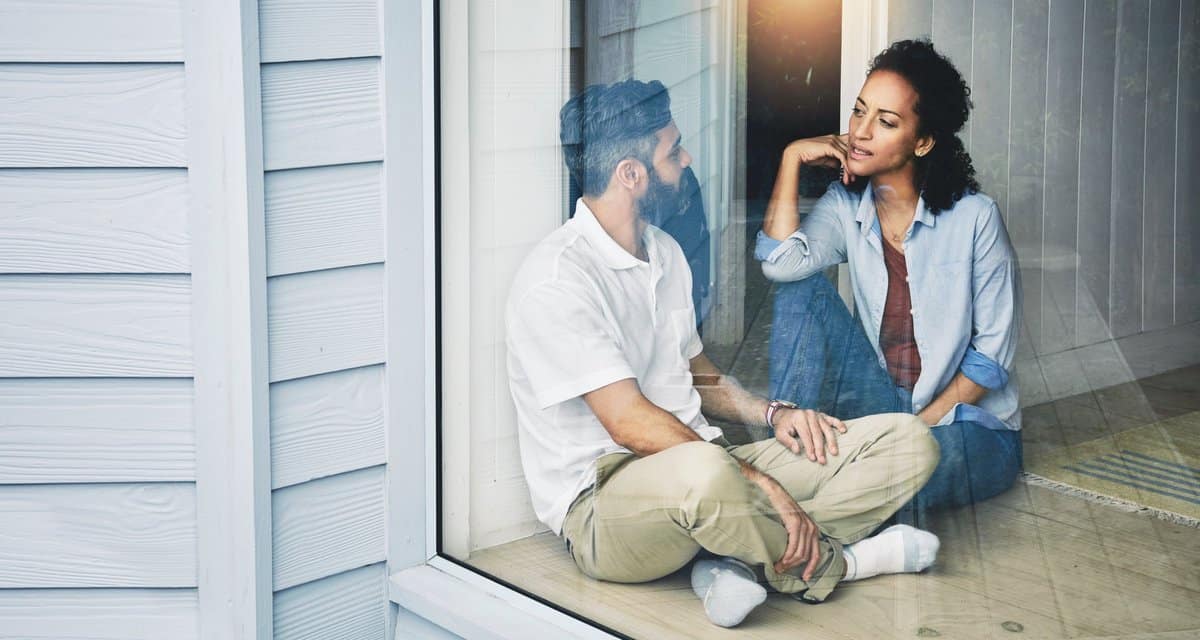 two people sitting on the floor and talking n.width IwLAY