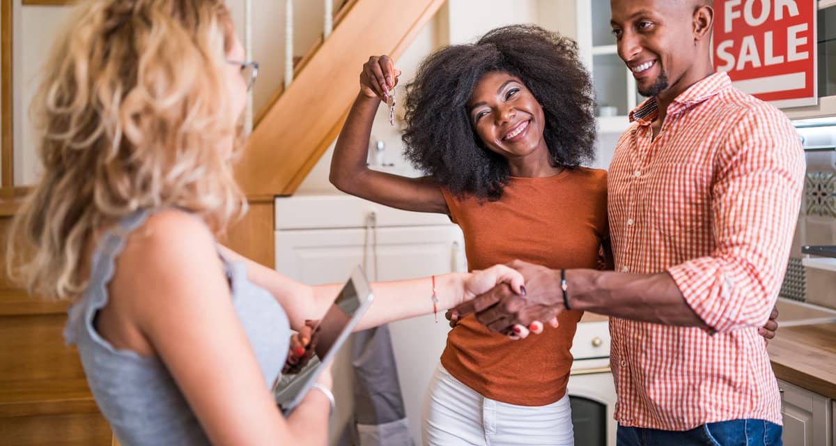 Real estate agent congratulating a new owner .width GeGttL.jpg