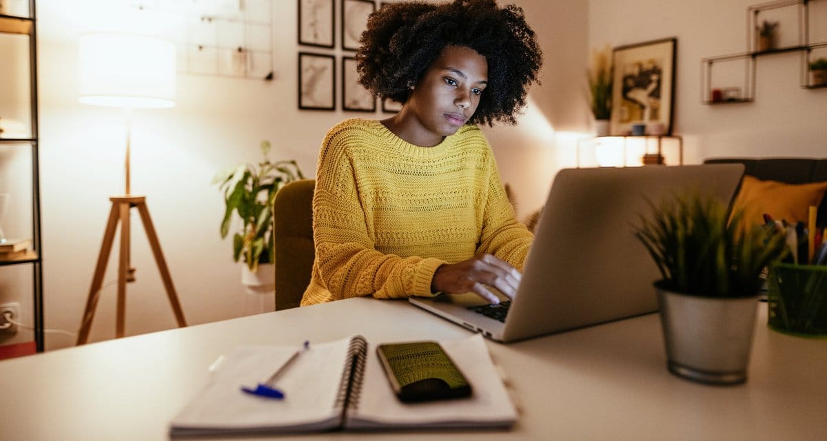Woman using laptop at home for work or study .width .jpg