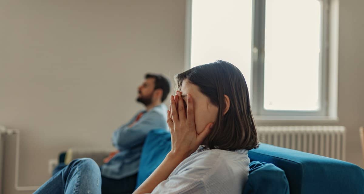 couple having an argument on couch.width .jpg