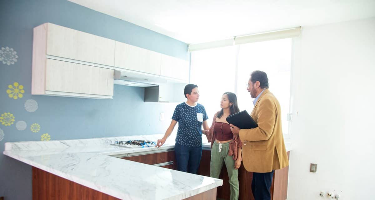 two people with realtor in kitchen XaHTHIU.width .jpg