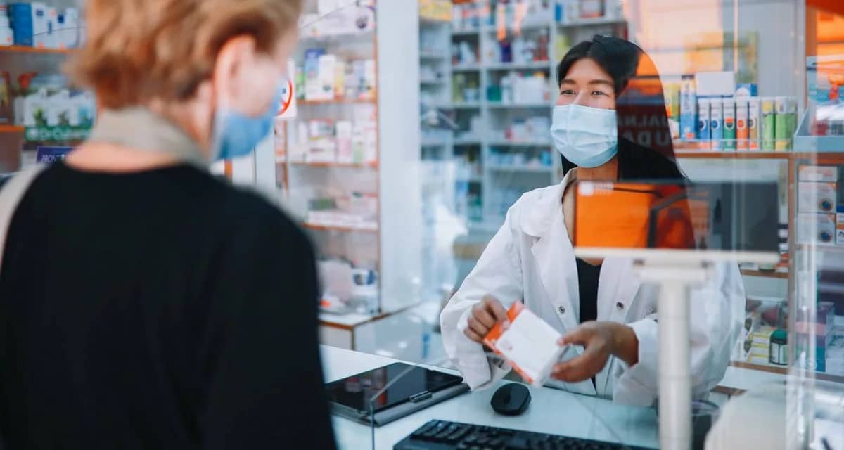 person receiving medicine from pharmacist IaP.width .jpg